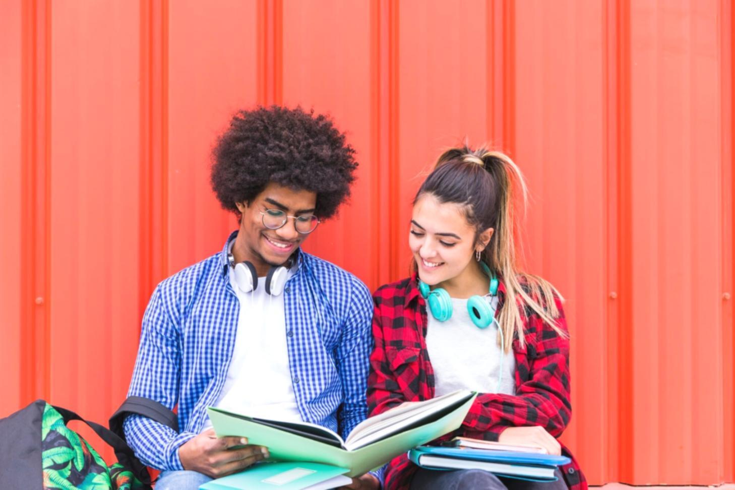 Financial planning materials including spreadsheets, calculators and investment charts arranged on desk