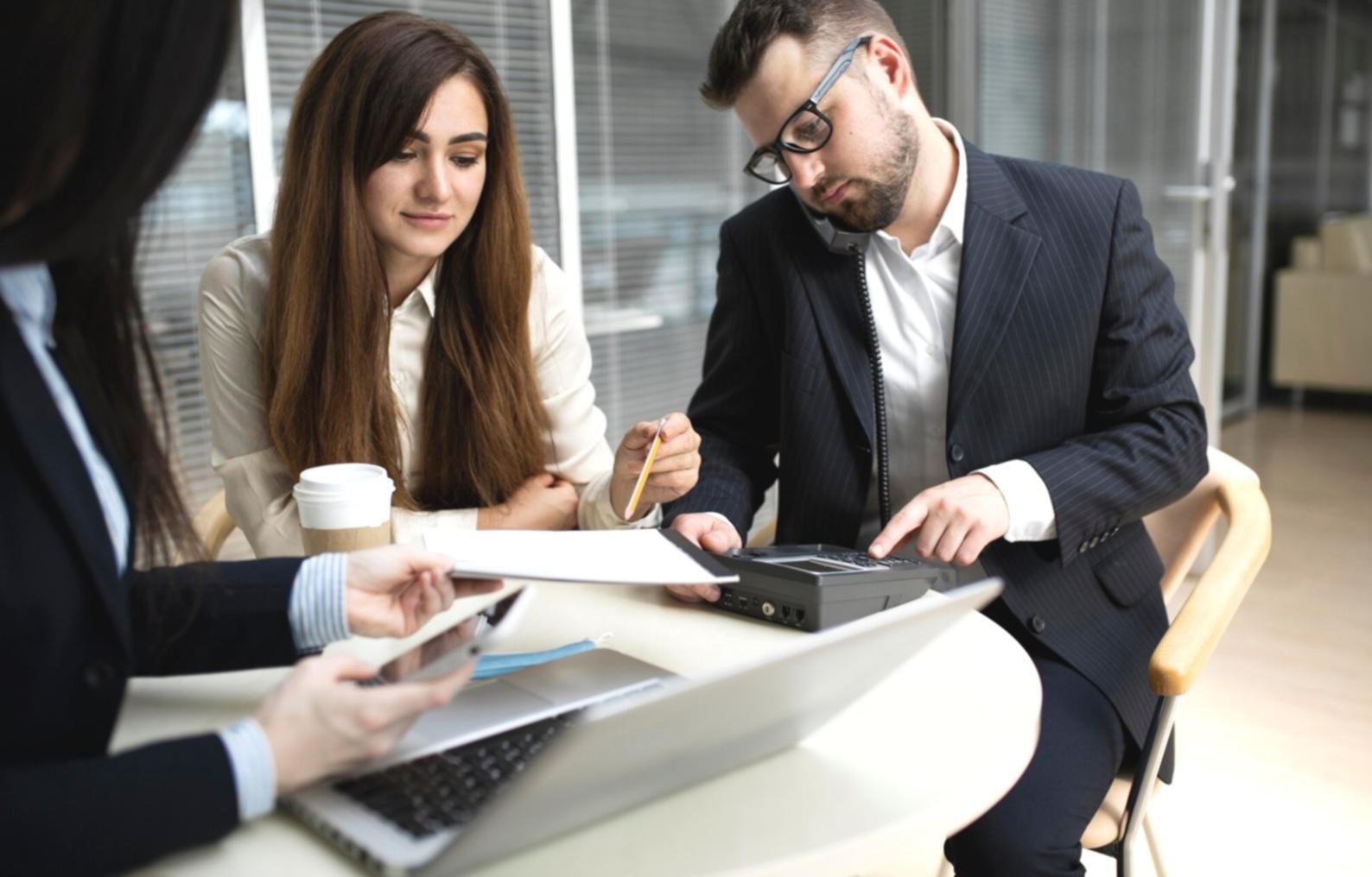 Financial educator explaining investment concepts to engaged learners